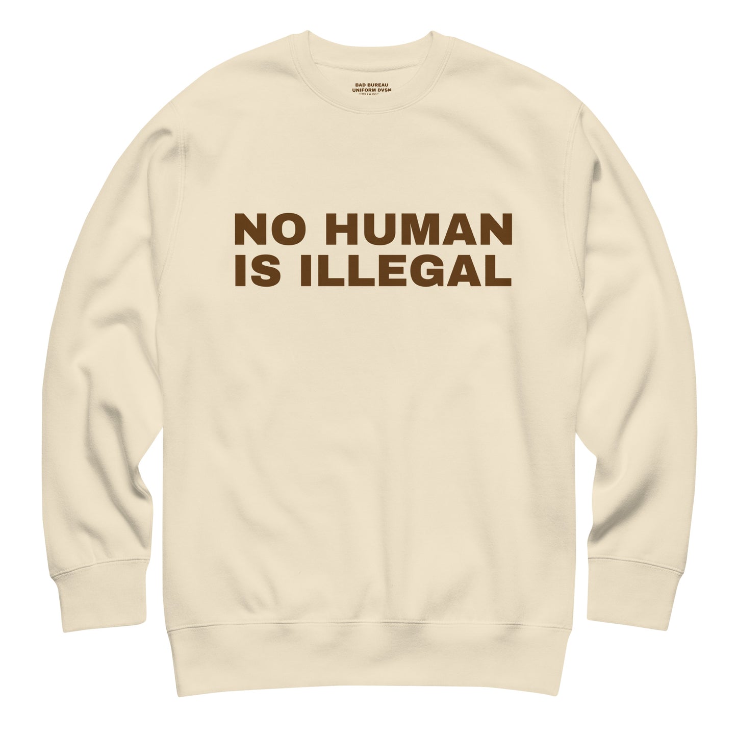 NO HUMAN IS ILLEGAL Crewneck Front View in Bone | BAD BUREAU 