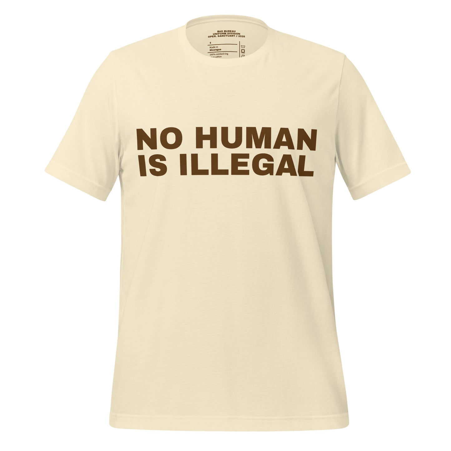 NO HUMAN IS ILLEGAL T-Shirt Front View in Bone | BAD BUREAU 