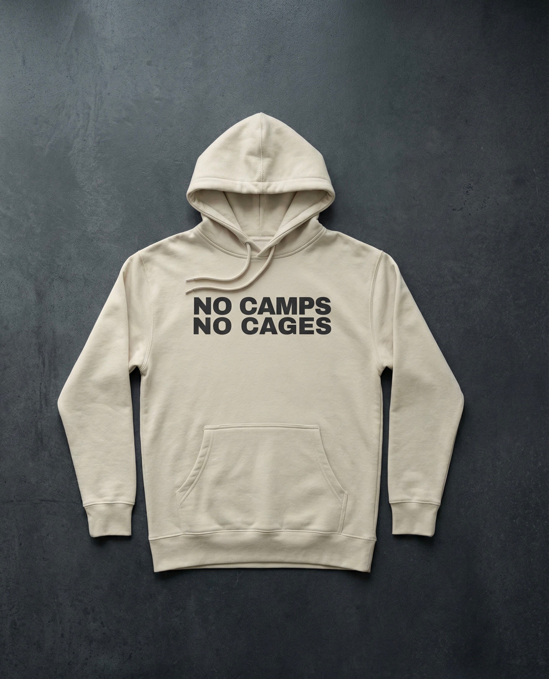 NO CAMPS NO CAGES Hoodie concrete background in bone | BAD BUREAU