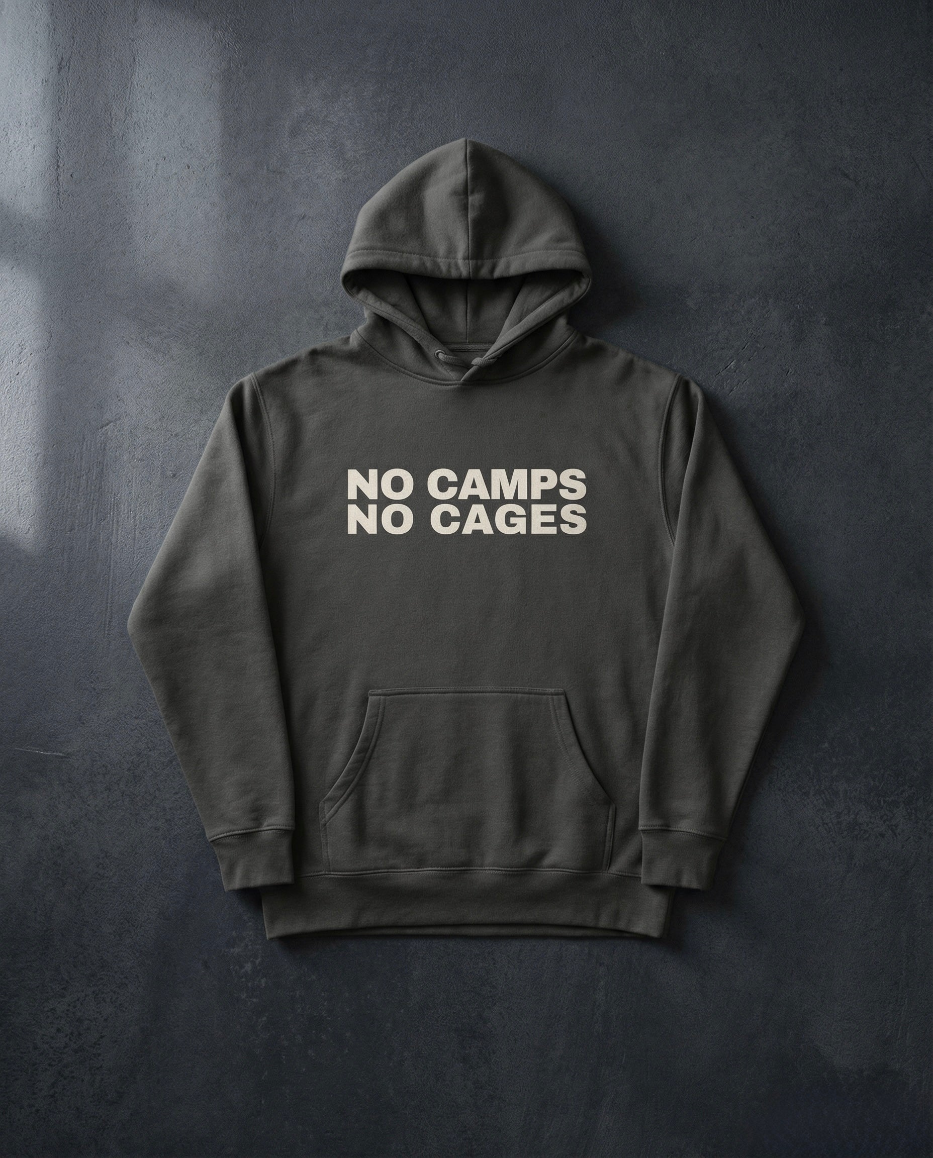 NO CAMPS NO CAGES Hoodie concrete background in vintage black | BAD BUREAU